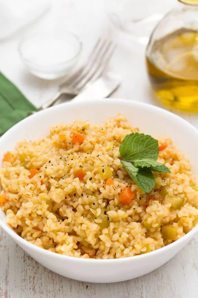 Couscous with vegetables in white bowl — Stock Photo, Image