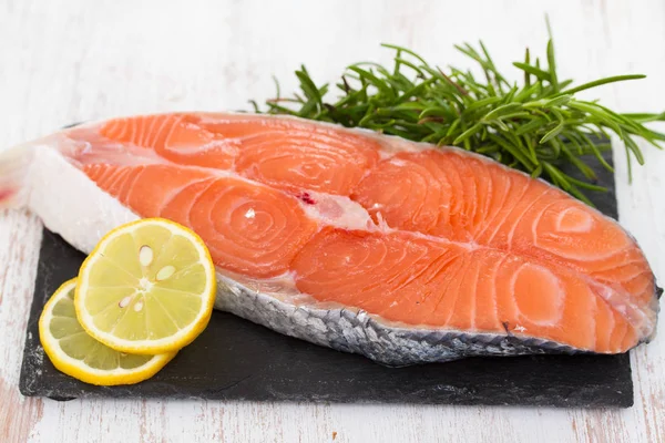 Raw fresh salmon with lemon — Stock Photo, Image