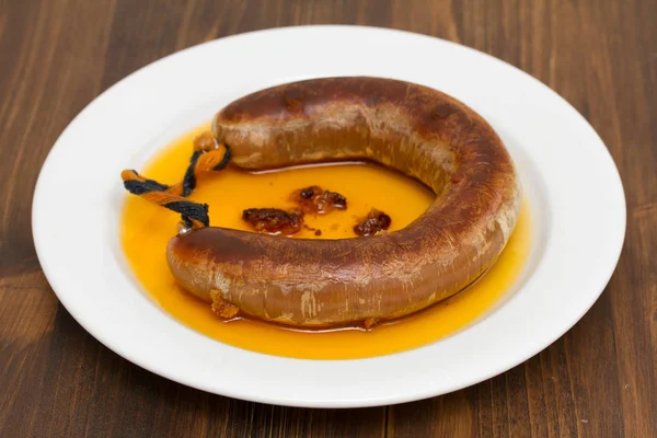 Fried smoked sausage farinheira on white plate — Stock Photo, Image