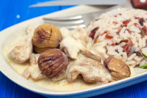 Turkey with chestnut and boiled rice on dish — Stock Photo, Image