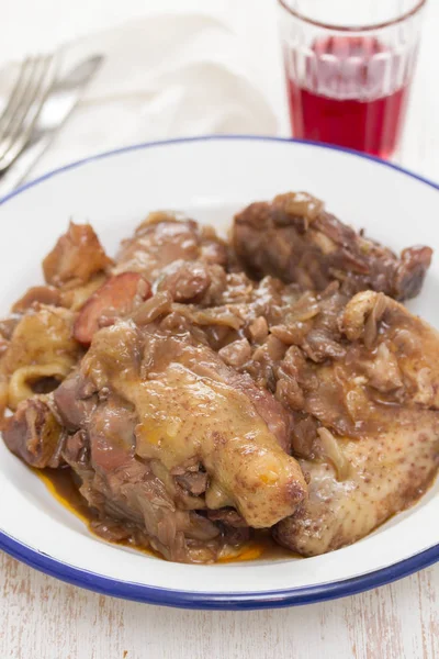 Chicken prepared with red wine in white plate — Stock Photo, Image