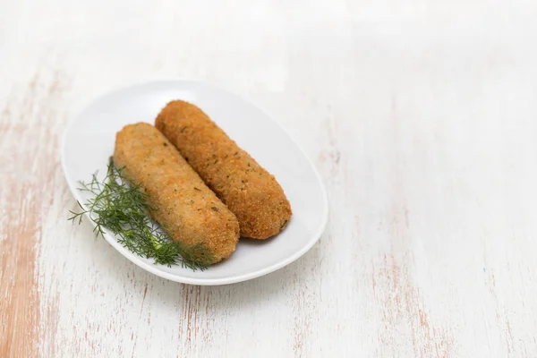 Meat croquetes on white dish — Stock Photo, Image