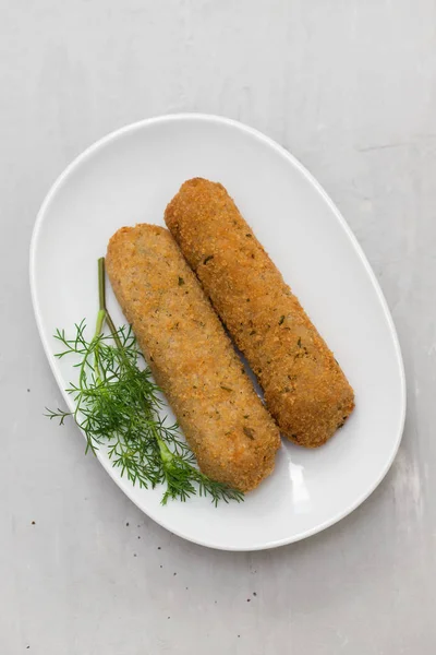 Meat croquetes on white dish — Stock Photo, Image