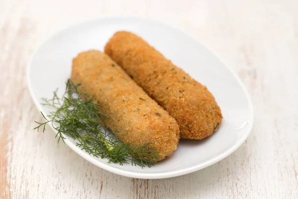 Meat croquetes on white dish — Stock Photo, Image