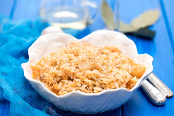 Rice wtih cod fish and tomato on beautiful white bowl — Stock Photo, Image