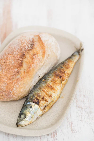 Grilled sardine with bread on dish — Stock Photo, Image