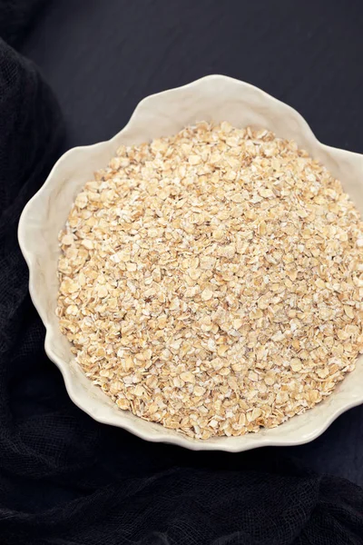 Oat meal in white bowl — Stock Photo, Image