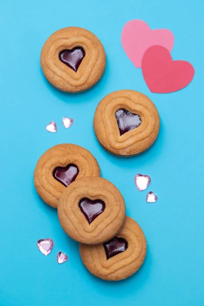 Cookies with hearts on blue background — Stock Photo, Image