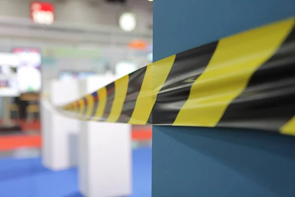 Barrier tape for no entry at an exhibition.do not cross ribbons — Stock Photo, Image