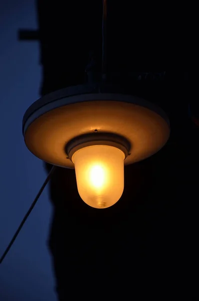 Old street lamp lit — Stock Photo, Image