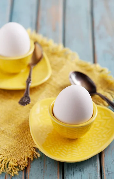 Eggs served in cups — Stock Photo, Image
