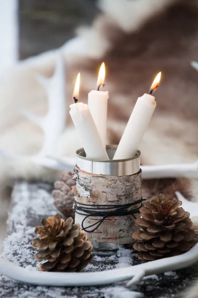Three white candles in tin can — Stock Photo, Image