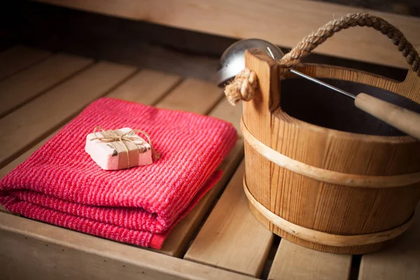 Water bucket, towel and soap — Stock Photo, Image