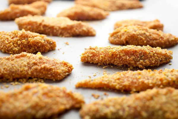 Homemade chicken fingers close-up view