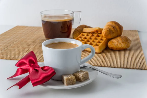 Fresh croissants and delicious waffles with two coffee on bamboo — Stock Photo, Image