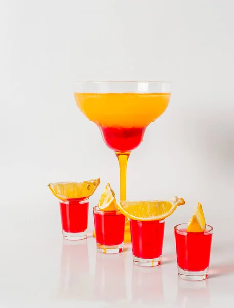 Colorful drink in a margarita glass, red and orange combination,