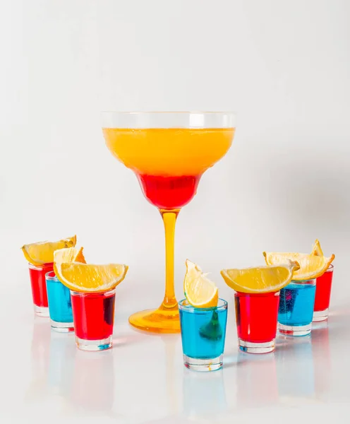 Colorful drink in a margarita glass, red and orange combination, — Stock Photo, Image