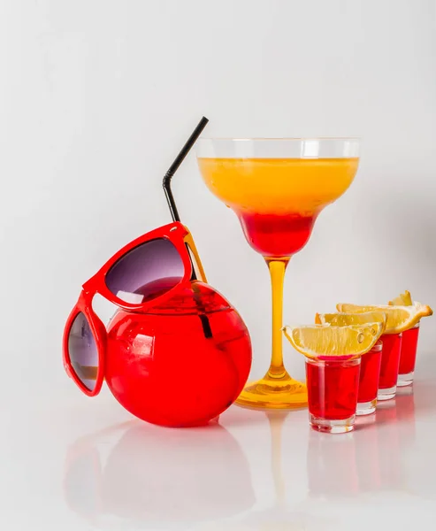 Colorful drink in a margarita glass, red and orange combination,