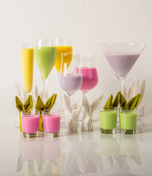 Colorful drinks based on milk liqueurs, unique pastel colors of
