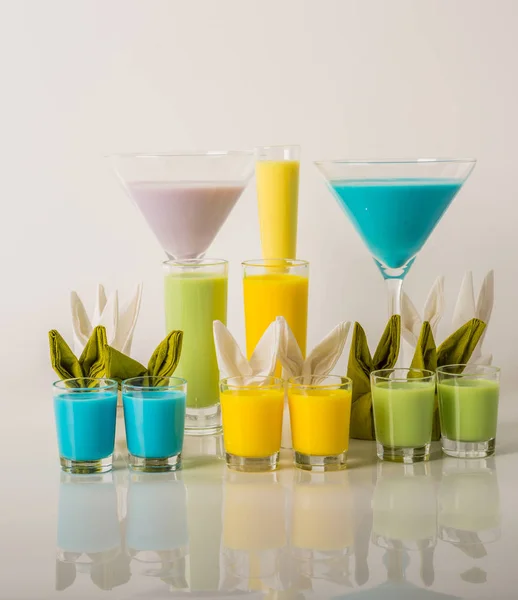 Colorful drinks based on milk liqueurs, unique pastel colors of