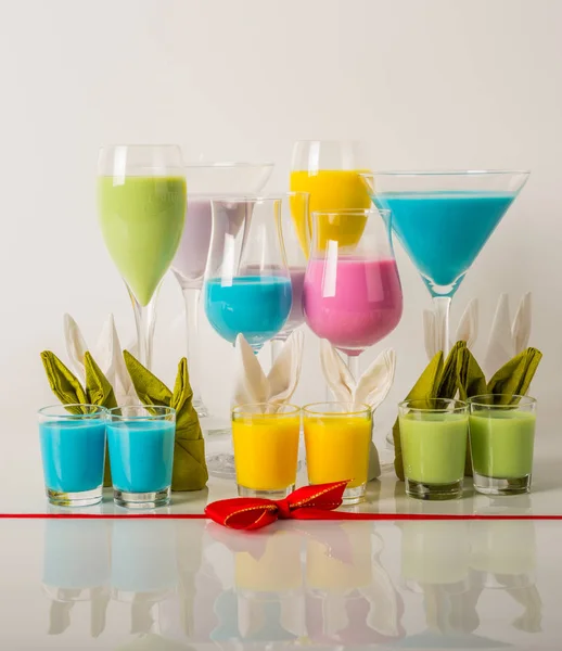 Colorful drinks based on milk liqueurs, unique pastel colors of