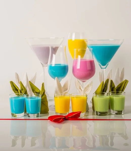 Colorful drinks based on milk liqueurs, unique pastel colors of