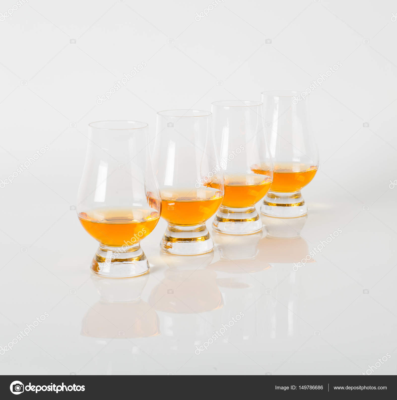 Set of single malt tasting glasses, single whisky in a glas Stock Photo by 149786686