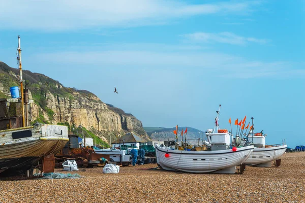 Fishing boats on the shore, pebble beach, wooden boats, fishing