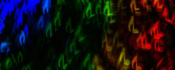Night lights bokeh shaped sheet music, defocused bokeh light, bl — Stock Photo, Image