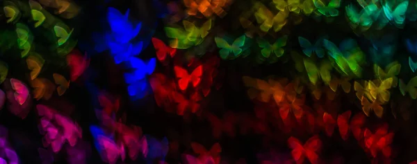 Night lights bokeh butterfly shape, defocused bokeh lights, blur — Stock Photo, Image