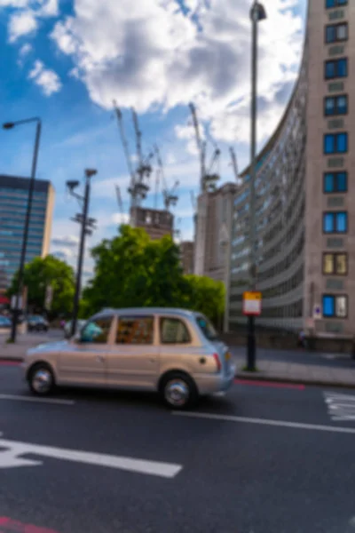 Abstract urban background with blurred buildings and street shal — Stock Photo, Image