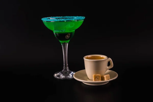Black coffee and colorful drink in a cocktail glass, with ice cu