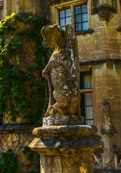 Old sculpture on the pedestal, beautifully preserved old artisti