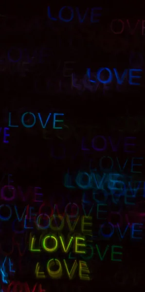 Beautiful background with different colored word love, abstract — стоковое фото