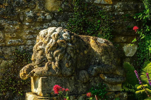 Old sculpture on the pedestal, beautifully preserved old artisti