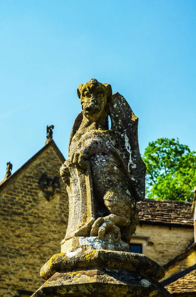 Old sculpture on the pedestal, beautifully preserved old artisti