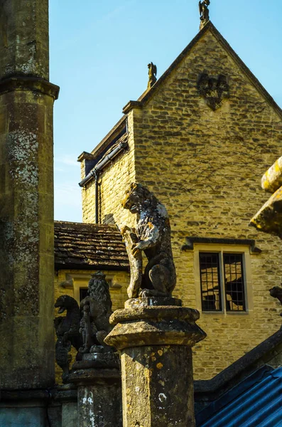 Old sculpture on the pedestal, beautifully preserved old artisti