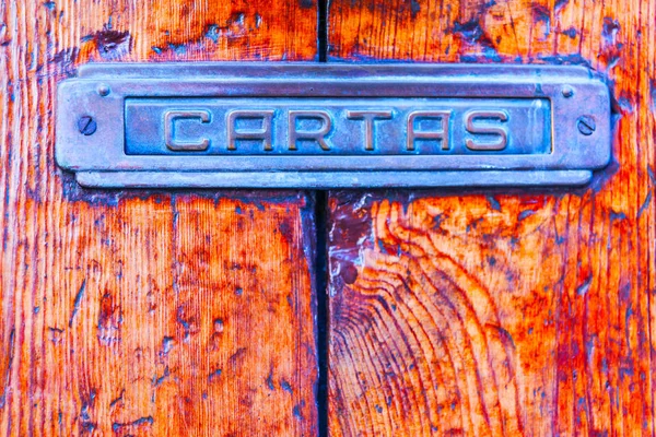 Old letterbox in the door, traditional way of delivering letters