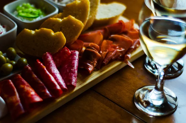 Board of meats and other starters, a variety of small dishes, a — Stock Photo, Image