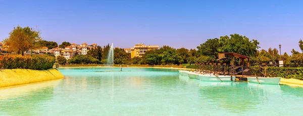 A beautiful place in a city park with water and moored white boats, a perfect place for a romantic time for couples and honeymooners, a unique location