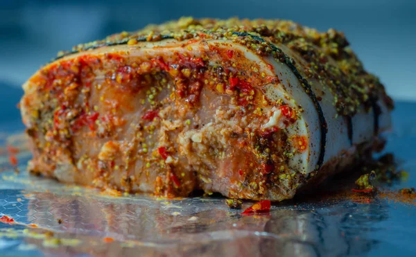 Boneless British rind-on pork loin joint, prepared in marinades, crackling joint, raw meat