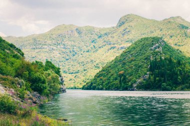 River and mountains in Bosnia and Herzegovina. Balkans. Bosnia and Herzegovina, river near the road clipart