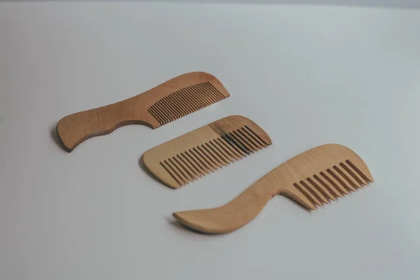 Wooden Comb on a neutral gray background