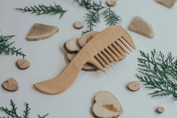 Wooden Comb on a neutral gray background