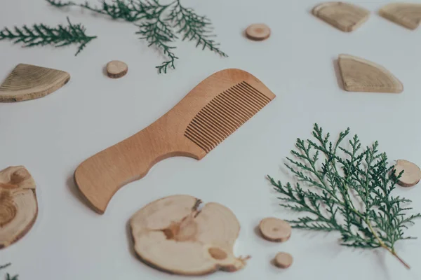 Wooden Comb on a neutral gray background