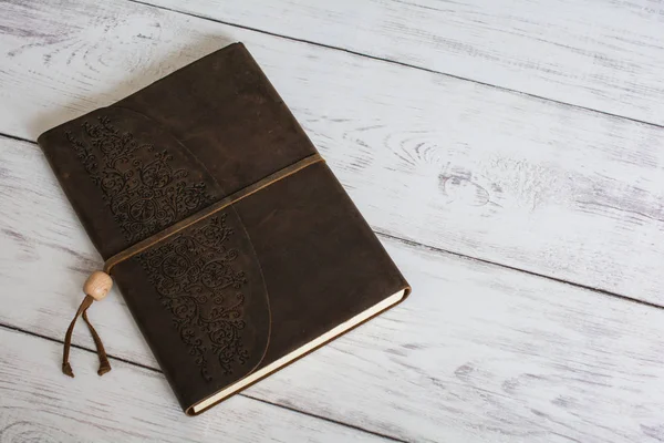 Classic Leather Bound Journal Book on a White Barn Board Floor