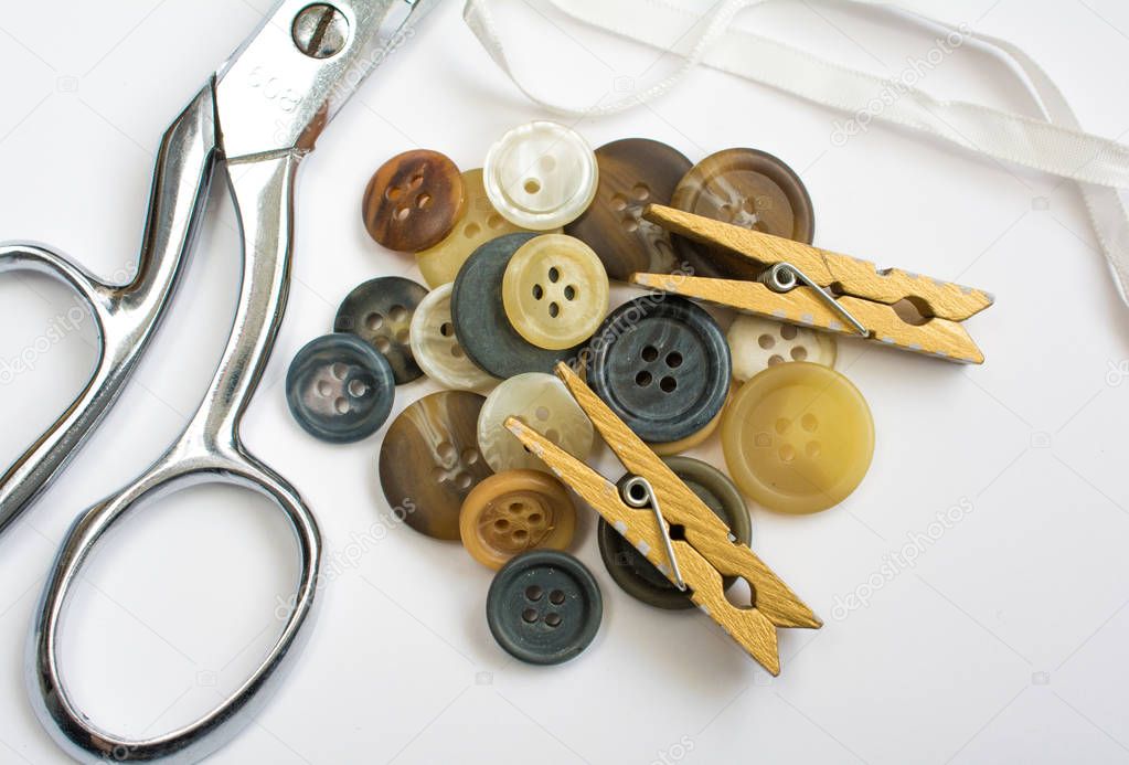 Pile of Buttons with Sewing Materials Isolated on White
