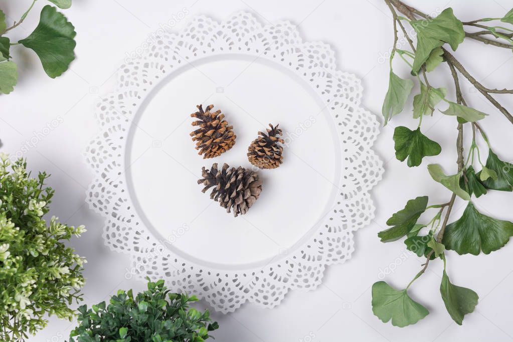 Pine Cones on Tray with Foliage Flat Lay Top View