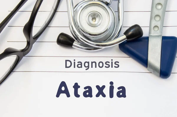 Neurological diagnosis of Ataxia. Neurological hammer, stethoscope and doctor's glasses lie on doctor workplace on sheet of notebook, labeled with the title of medical diagnosis of Ataxia — Stock Photo, Image