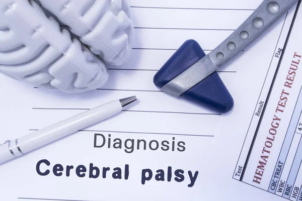 Diagnosis Cerebral palsy. Figure brain, neurological hammer, printed on a paper blood test and written diagnosis of Cerebral palsy in  medical form is lying on table in the doctor neurologist cabinet — Stock Photo, Image